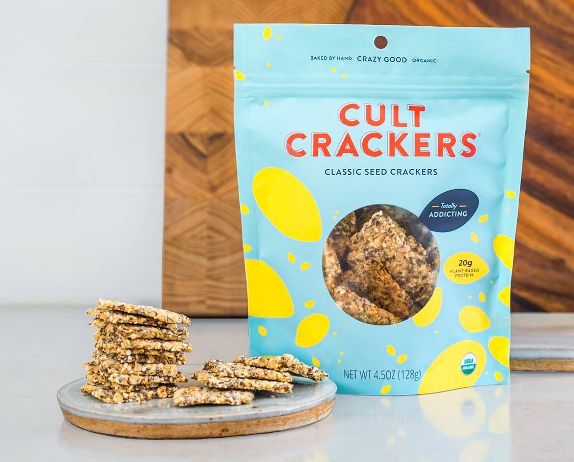 a bag of cult crackers next to a plate of crackers