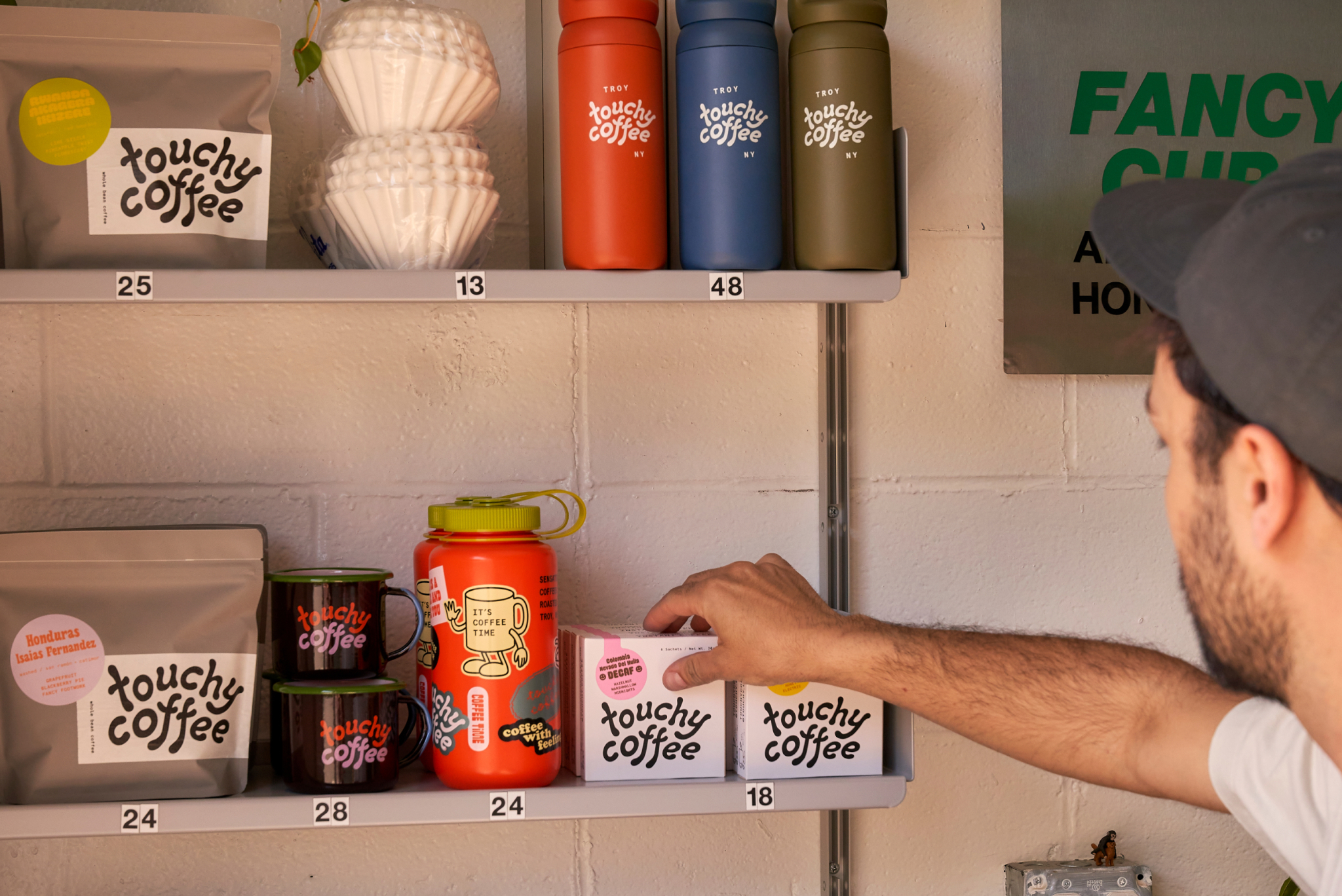 a man places an item on a shelf